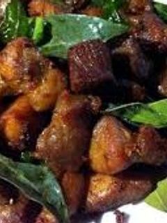 Hình của món Thịt xiên nướng lá mắc mật.
