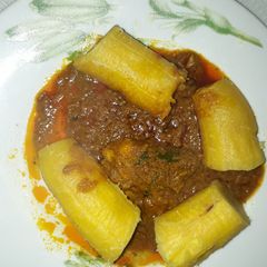 A picture of Boiled plantain with garden egg sauce.