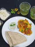Aloo kutly with roti,kheer and mint margariya