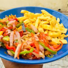 A picture of Sweet potatoe chips and vegetables stir fry.