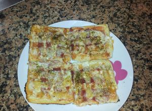 Una foto de Pizza de pan bimbo 