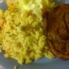 A picture of Vegetables rice with grilled pork.