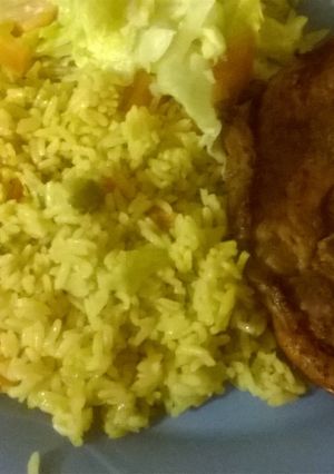 A picture of Vegetables rice with grilled pork.