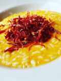 Risotto alla crema di zucca, con riccioli di capocollo tostato