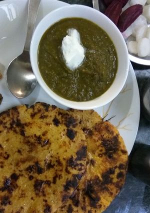 A picture of Sarson da Saag with Makki di Roti.