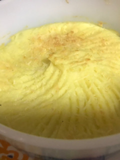Una foto de Puré de papas con queso extra