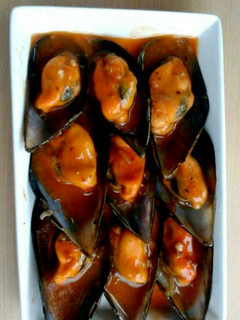 Una foto de Mejillones en salsa picante.