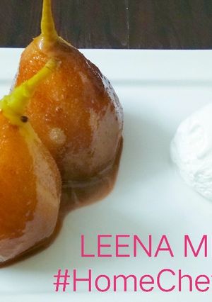 A picture of Poached pears with chocolate and ice-cream.