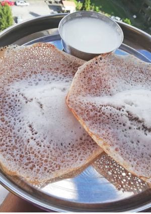 A picture of Appam with coconut milk.
