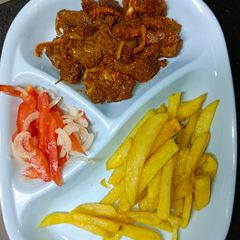A picture of Goat Meat Dry Fry with Fries and Kachumbari.