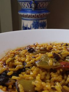 Una foto de Arroz meloso con morcilla de cebolla y longaniza