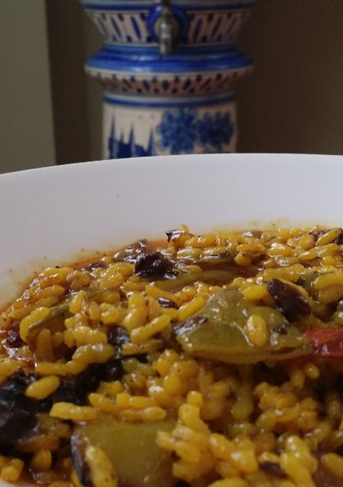 Una foto de Arroz meloso con morcilla de cebolla y longaniza