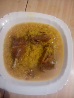 Una foto de Arroz con pollo de campo