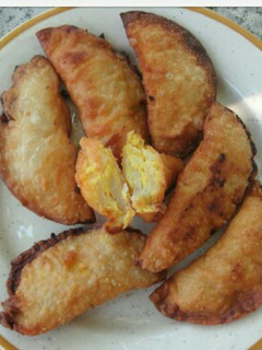 Una foto de Empanadilla rellena de tortilla de patatas 