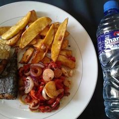 A picture of Fried yam with grilled Titus fish.
