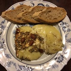 A picture of California Farm Honey Almond Baked Brie CheeseCake Dessert.