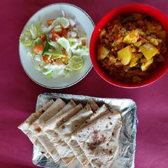 Cauliflower, carrot and potato/ veg/ with salad and chapati A picture of Cauliflower, carrot and potato/ veg/ with salad and chapati.