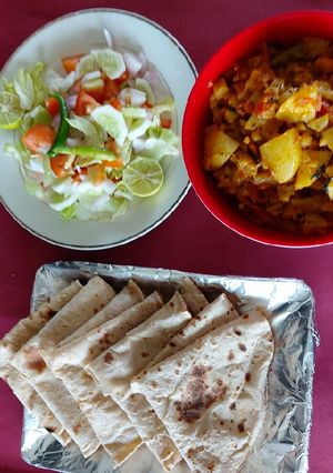A picture of Cauliflower, carrot and potato/ veg/ with salad and chapati.
