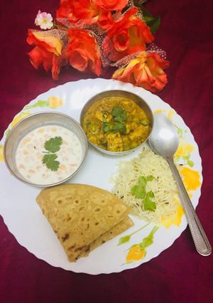 A picture of Mater paneer bundi raita jeera rice paratha(In proper lunch thali).