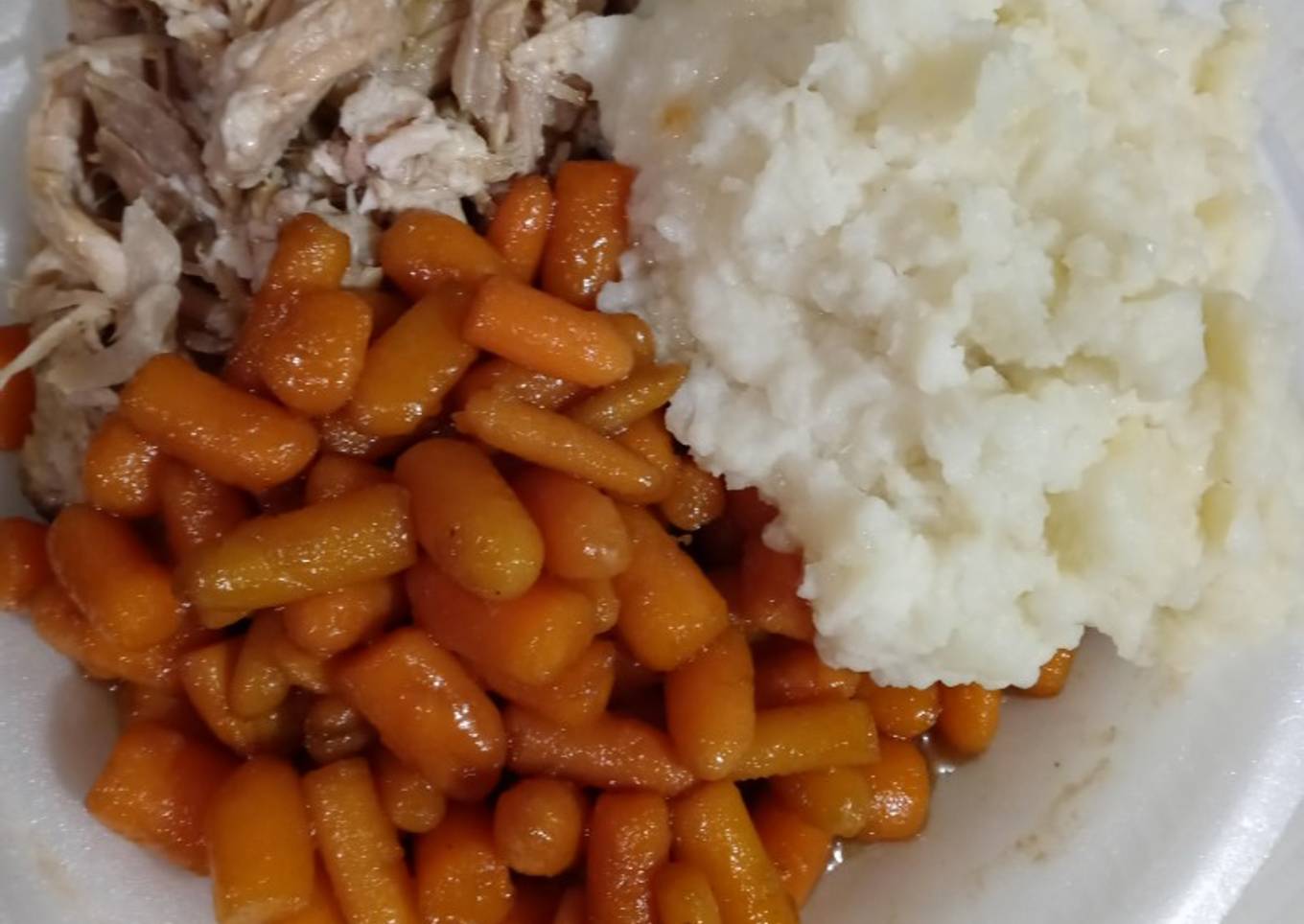 Slow fried pork with mashed potatoes and layered carrots