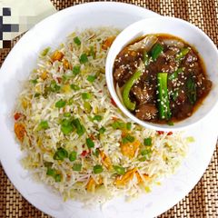 A picture of Mangolian Beef with Fried Rice.