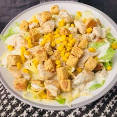 A picture of Chicken cesar salad.