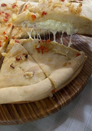 Una foto de Fugazza rellena con Masa Saborizada