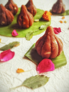 A picture of Butterscotch milk and Chickpea Modak.
