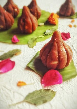A picture of Butterscotch milk and Chickpea Modak.
