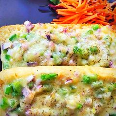 A picture of Veggies loaded cheesy garlic bread.