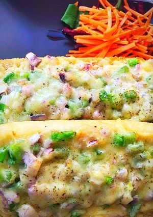 A picture of Veggies loaded cheesy garlic bread.