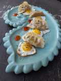 Gyozas de ternera con huevos de codorniz y salsa sweet chilli