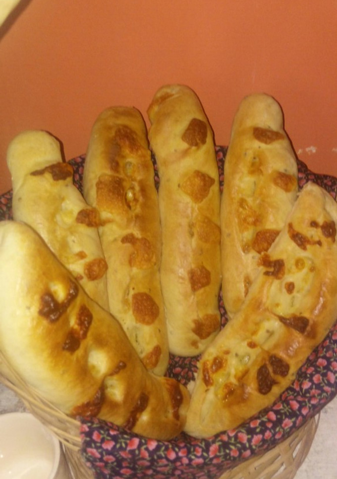 Una foto de Pan quesu (pan con queso)