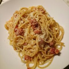 A picture of Spaghetti with pancetta, tomatoes and pecorino.