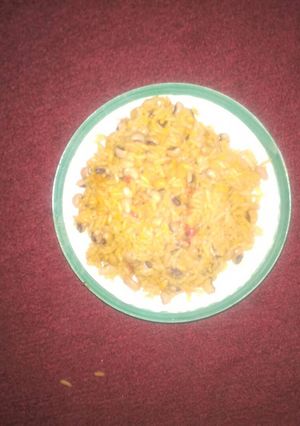 A picture of Palm oil rice and beans.