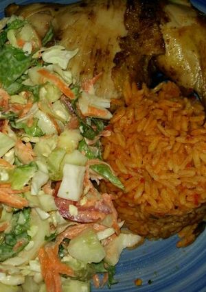 A picture of Jollof Rice, Veg Salad and Chicken.