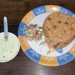 A picture of Tawa Pulav with Haryali Raita.