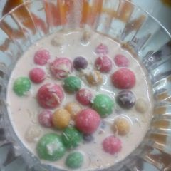 A picture of Colourful creamy drops in dry fruit milk.
