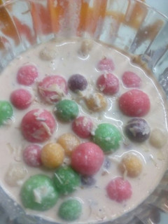A picture of Colourful creamy drops in dry fruit milk.