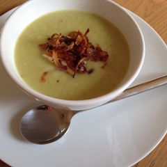 A picture of Leek and celery soup with spiced onions.