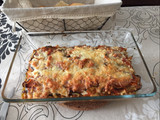 Lasaña de berenjena rellena de carne y rulo de cabra con topping de bacon y 4 quesos