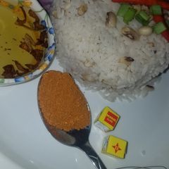 A picture of Rice and beans with oil and pepper.