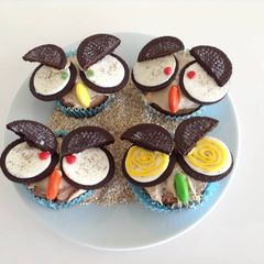 A picture of Owl cupcakes with Oreos for Halloween.
