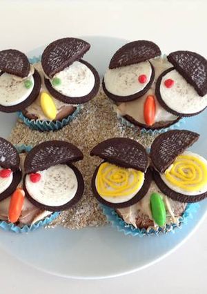 A picture of Owl cupcakes with Oreos for Halloween.