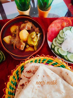 A picture of Aloo Matar Gosht.