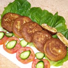 A picture of Hotteok filled with vegetables and noodles_ Korean pancake.