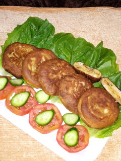 A picture of Hotteok filled with vegetables and noodles_ Korean pancake.