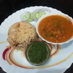 Black Chana Curry with fried rice A picture of Black Chana Curry with fried rice.