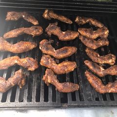 A picture of Spicy dry jerk rubbed smoked chicken wings.