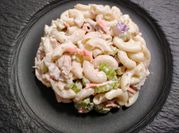 A picture of macaroni with shredded chicken